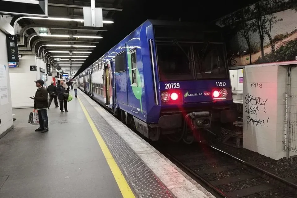 An RER D double-decker train at a station platform